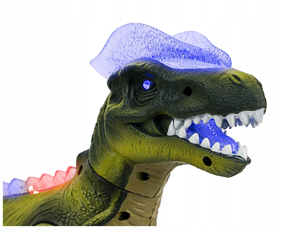 Interaktywny dinozaur z otwartą paszczą, z widocznymi białymi zębami i niebieskim podświetleniem LED na grzbiecie oraz w paszczy. Dinozaur ma zieloną skórę z teksturą przypominającą łuski.