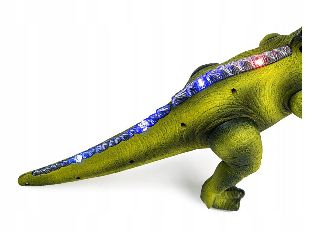 Fragment zielonego interaktywnego dinozaura z widocznymi niebieskimi i czerwonymi diodami LED wzdłuż grzbietu ogona.