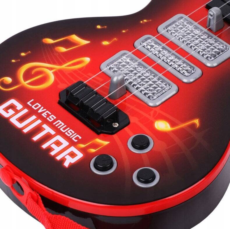 Czerwona gitara z trzema srebrnymi przetwornikami i czarnymi przyciskami. Na korpusie widoczny jest napis \'LOVES MUSIC GUITAR\' oraz motywy nutowe.
