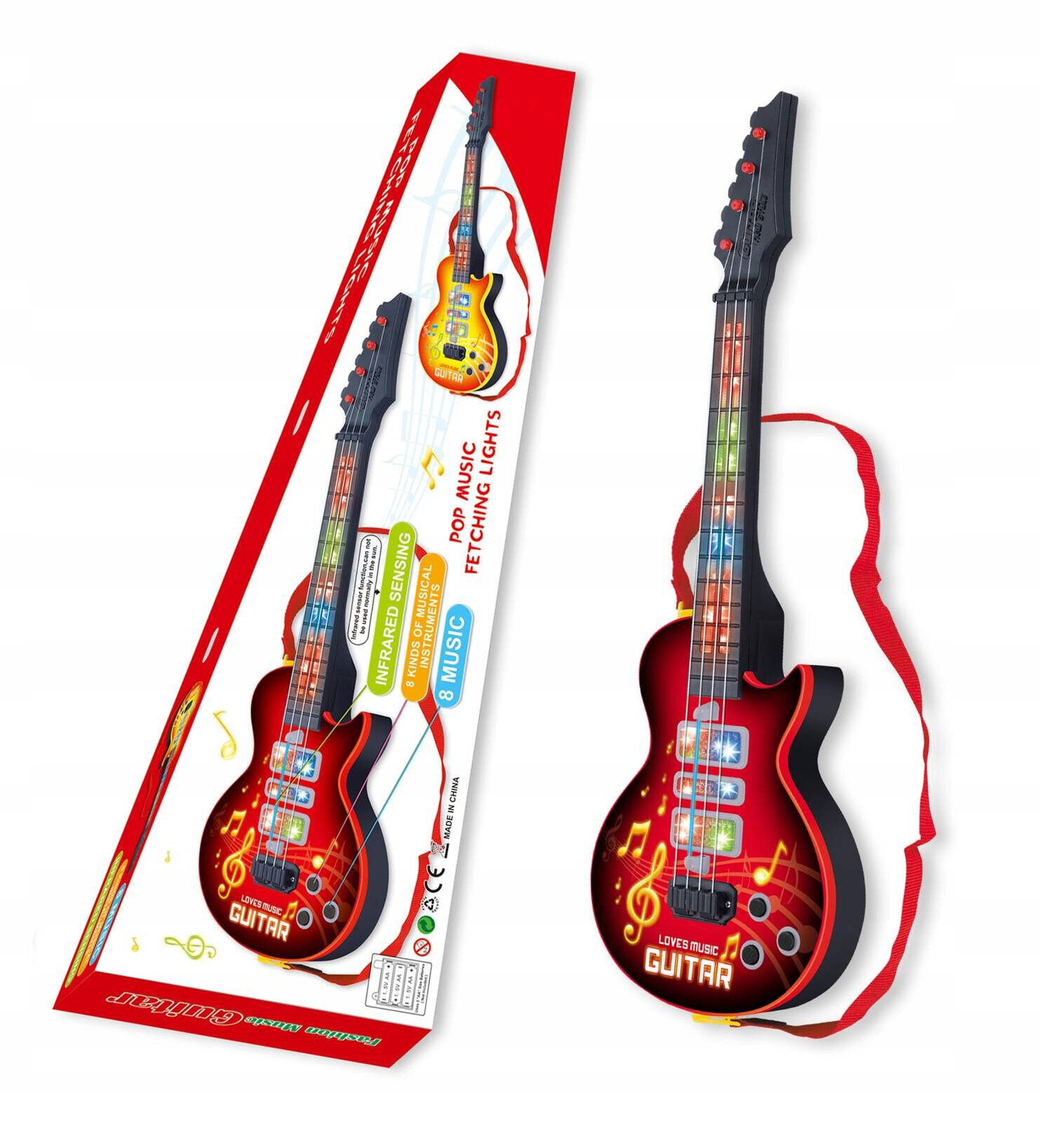 Obraz przedstawia zabawkową gitarę elektryczną z kolorowymi przyciskami i czerwonym paskiem. Na opakowaniu widnieje tekst: \'LOVES MUSIC GUITAR\', \'POP MUSIC FETCHING LIGHTS\', \'INFRARED SENSING\', \'8 MUSIC\'.