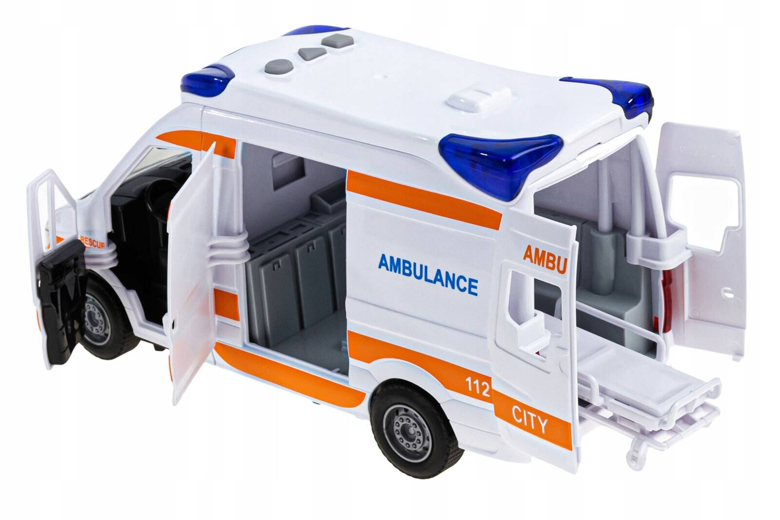 Zabawka przedstawia białą karetkę z otwartymi drzwiami, pomarańczowymi paskami i napisami \'AMBULANCE\', \'112\', \'CITY\'. Wewnątrz widoczne są nosze i siedzenia.