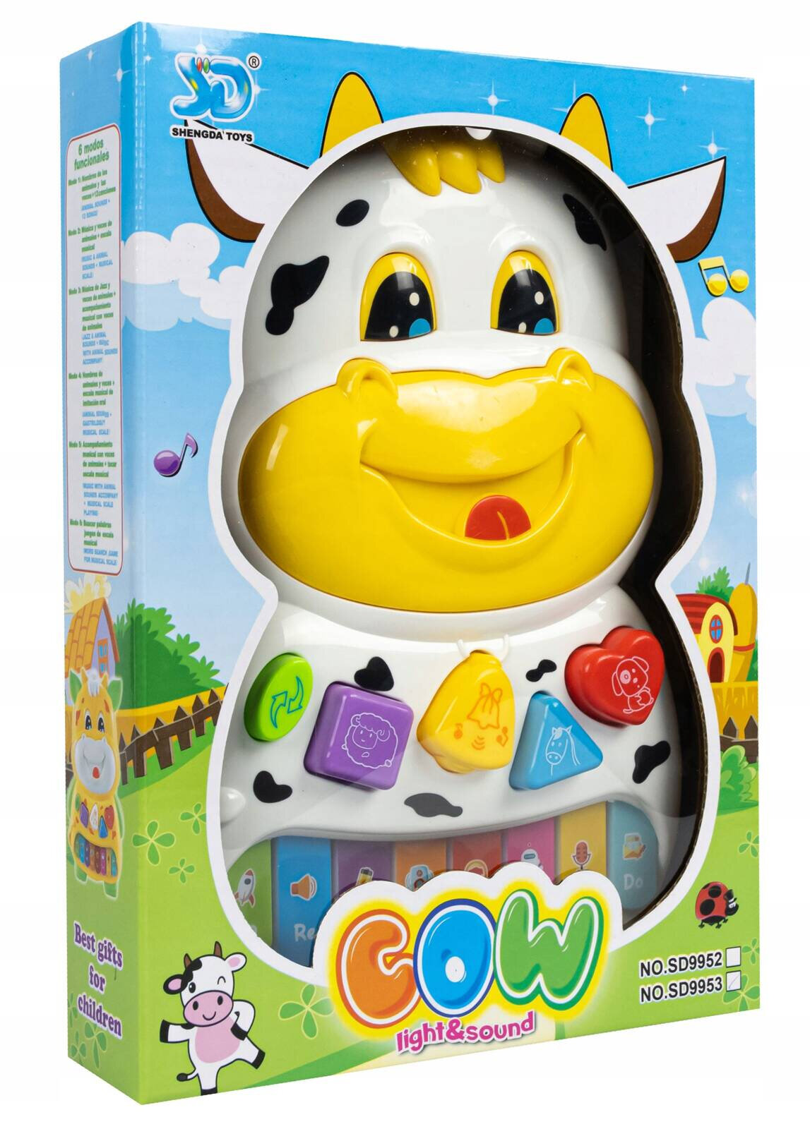 Opakowanie zabawki w kształcie krowy z kolorowymi przyciskami w różnych kształtach. Na opakowaniu widnieje napis \'COW light & sound\' oraz logo \'SHENGDA TOYS\'.