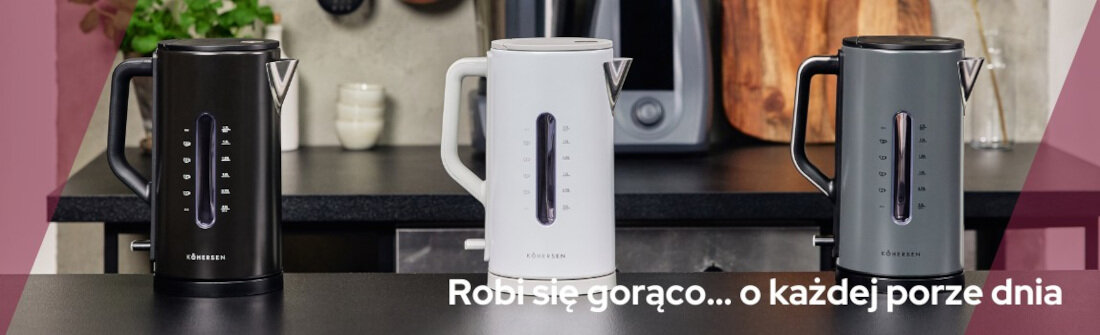Na blacie kuchennym stoją trzy czajniki elektryczne w kolorach czarnym, białym i szarym. Na dole obrazu widnieje tekst: \'Robi się gorąco... o każdej porze dnia\'.