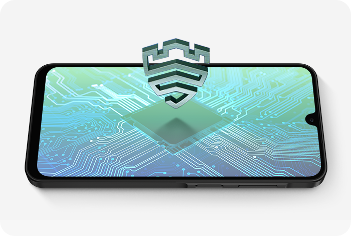 Smartfon z wyświetlaczem pokazującym grafikę przedstawiającą układ scalony z nałożoną ikoną tarczy. Tło jest w odcieniach zieleni i błękitu.