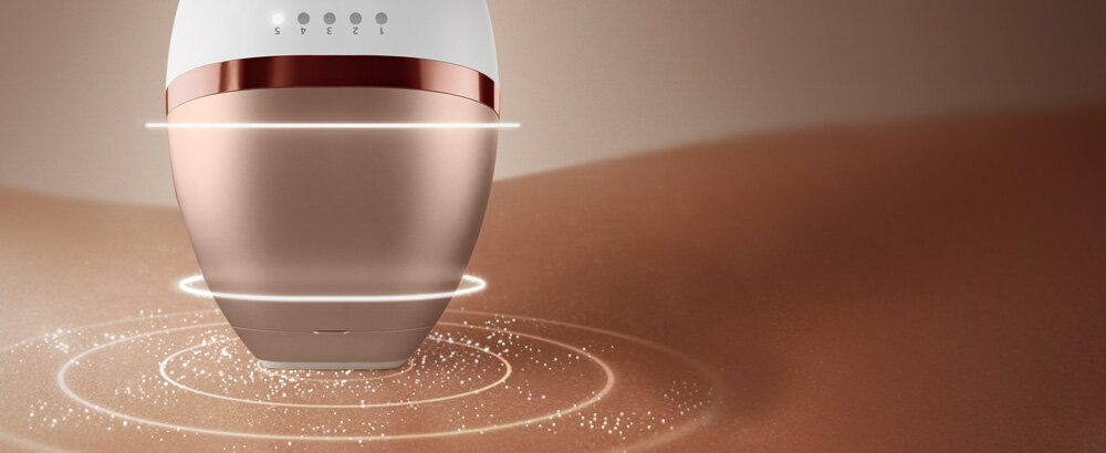 Depilator Philips Lumea dotyka skóry. Wokół niego roztaczają się świetlne okręgi.