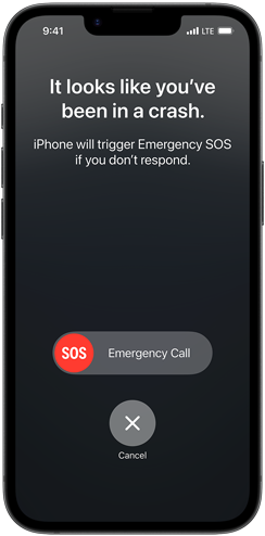 Na ekranie smartfona widoczny jest komunikat: \'It looks like you\'ve been in a crash. iPhone will trigger Emergency SOS if you don\'t respond.\' oraz przyciski \'SOS Emergency Call\' i \'Cancel\'.