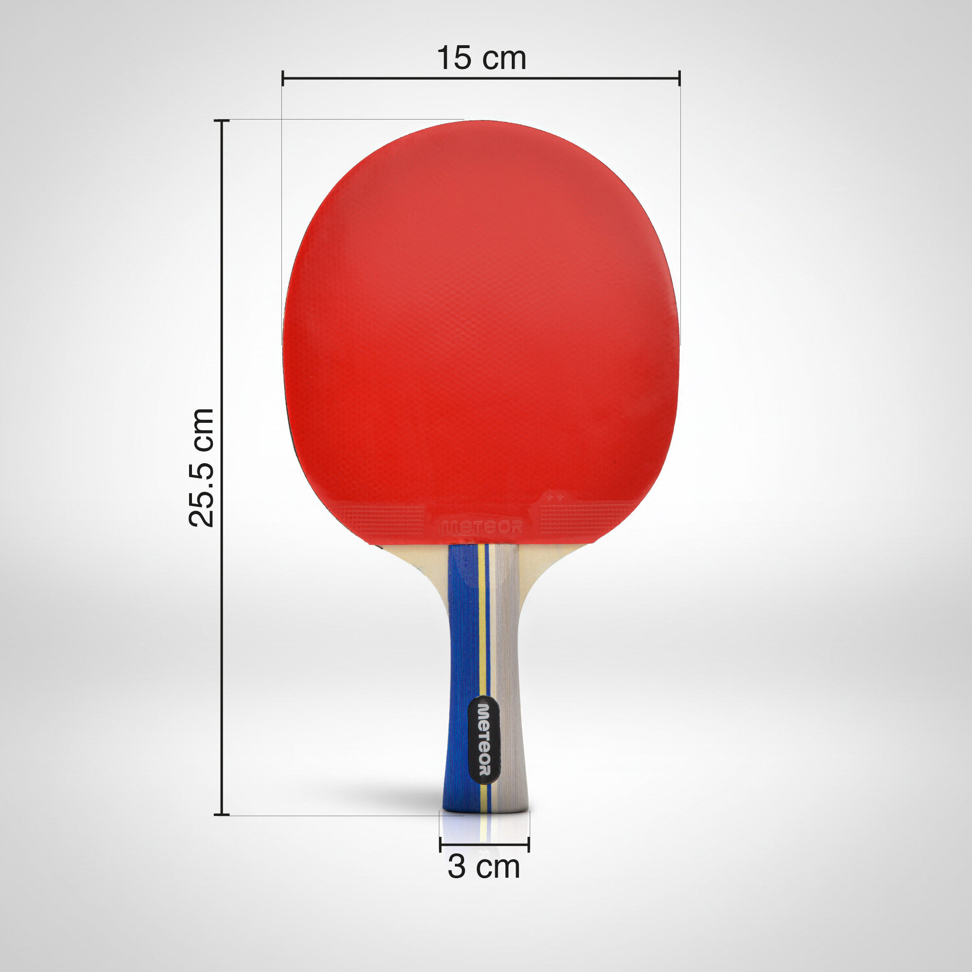Rakietka do tenisa stołowego z czerwonym obiciem i niebiesko-białym uchwytem. Wymiary: 15 cm szerokości, 25,5 cm wysokości, 3 cm szerokości uchwytu; widoczne logo \'meteor\'.