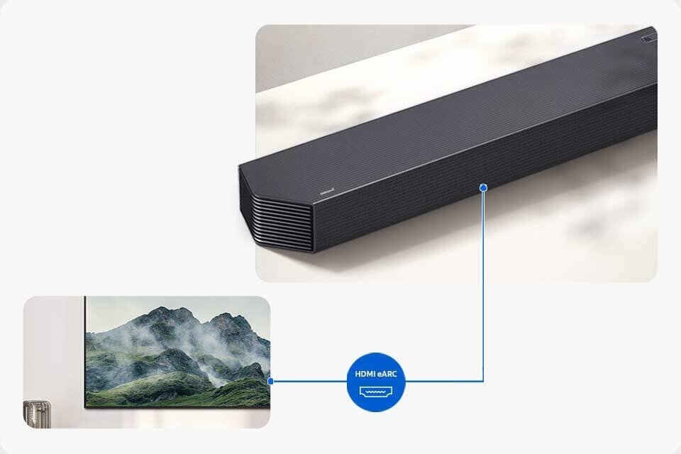 Na obrazie widoczny jest czarny soundbar z napisem \'Samsung\' oraz telewizor wyświetlający krajobraz górski. Pomiędzy nimi znajduje się niebieski symbol z napisem \'HDMI eARC\'.