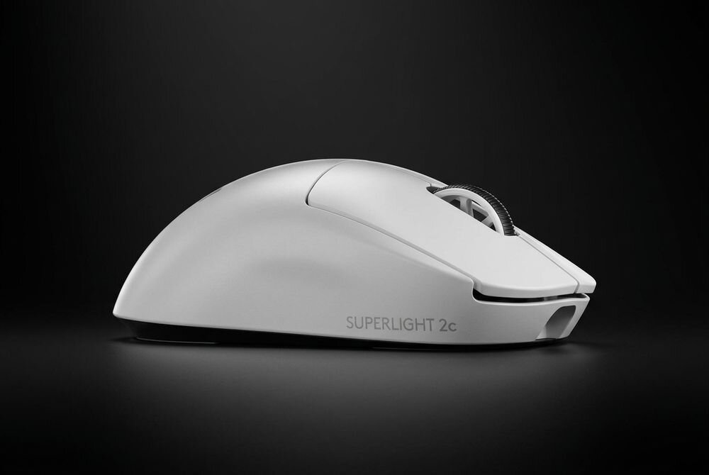 Biała mysz komputerowa z napisem \'SUPERLIGHT 2c\' na boku, umieszczona na ciemnym tle.
