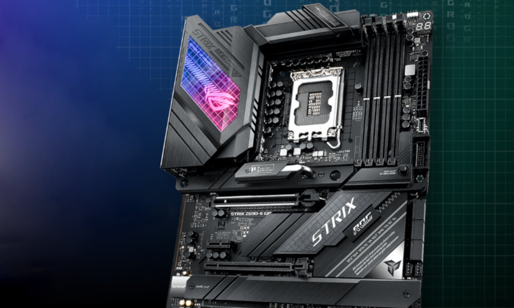 Obraz przedstawia czarną płytę główną z widocznymi elementami elektronicznymi i podświetleniem RGB. Na płycie widoczny jest napis \'STRIX\' oraz logo \'ROG\'.