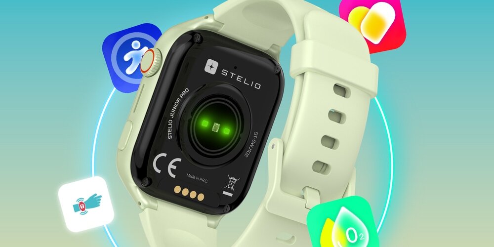 Smartwatch z napisem \'STELIO JUNIOR PRO\' i logo \'STELIO\' na czarnym tle, z zielonym światłem na środku. W tle widoczne są kolorowe ikony aplikacji.