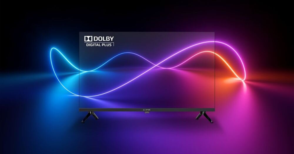 Telewizor z wyświetlaczem pokazującym kolorowe, faliste linie na ciemnym tle. Widoczny tekst: \'DOLBY DIGITAL PLUS\'.