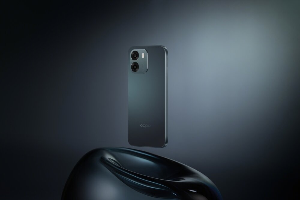 Smartfon w ciemnozielonym kolorze unosi się nad ciemnym, błyszczącym obiektem. Na obudowie widoczne jest logo \'oppo\'.