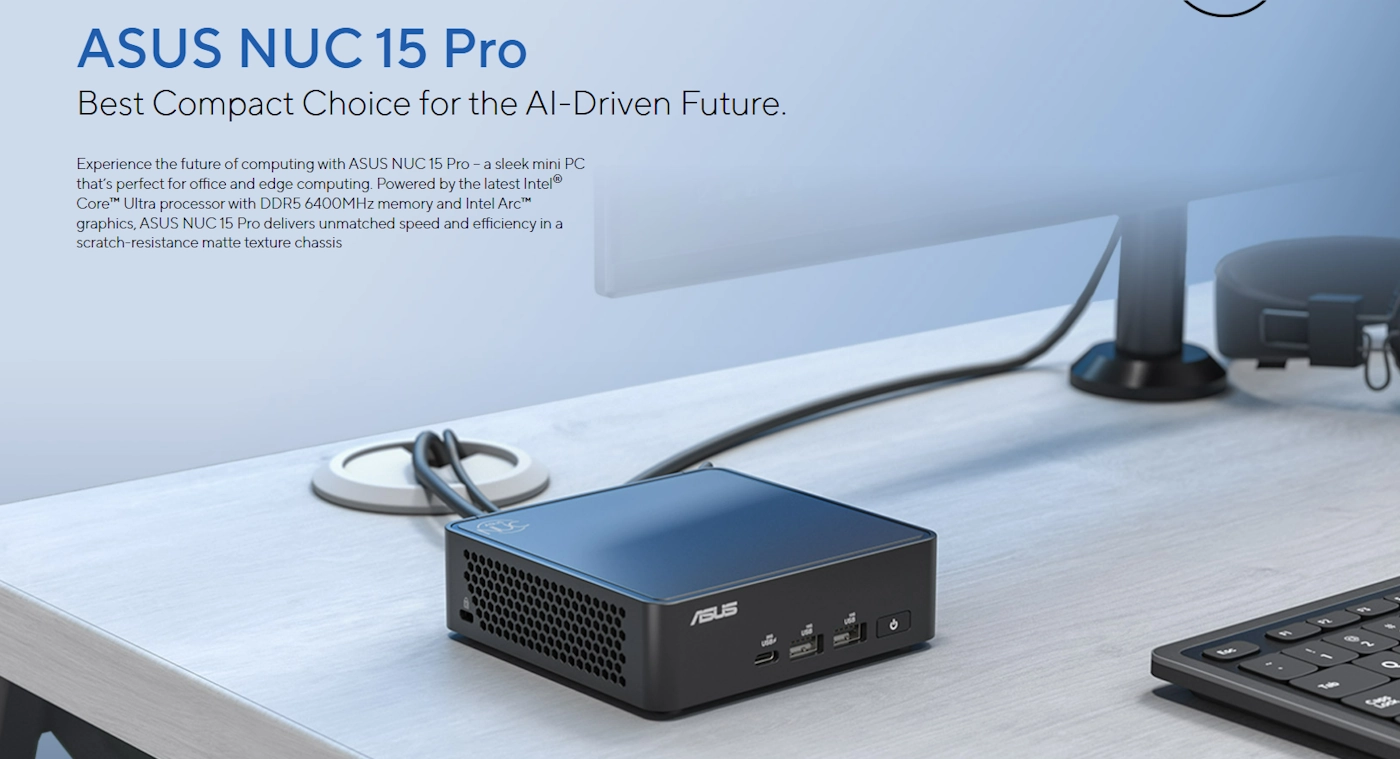 Na biurku znajduje się kompaktowy komputer z logo \'ASUS\', obok którego leży klawiatura i monitor. Na obrazie widoczny jest tekst: \'ASUS NUC 15 Pro Best Compact Choice for the AI-Driven Future.\'