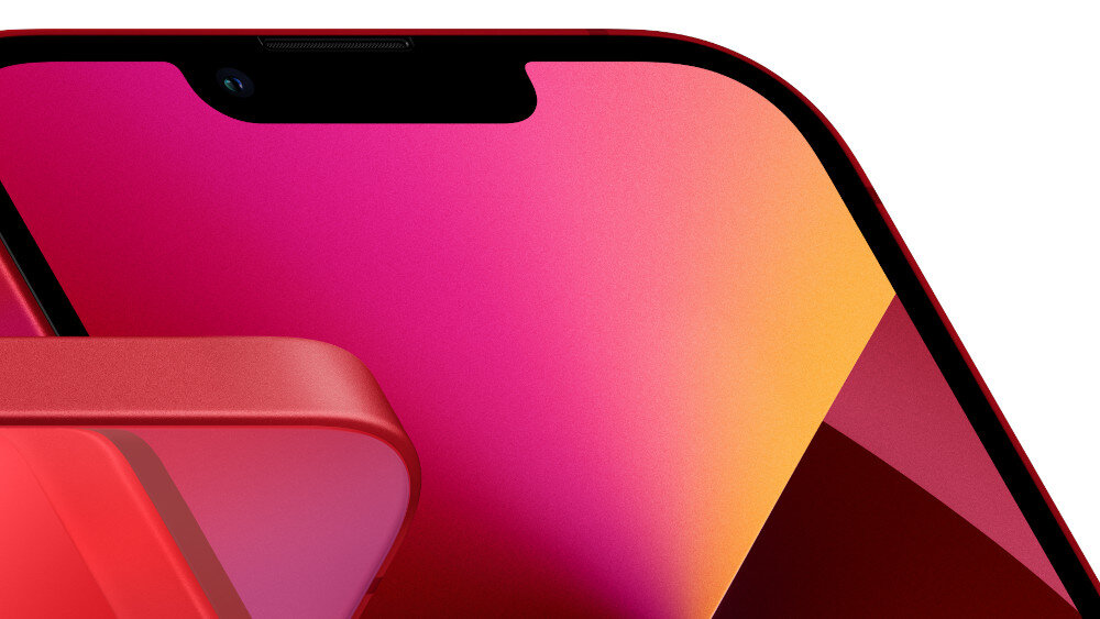 Zbliżenie na różowy smartfon z wyświetlaczem o gradientowym tle w odcieniach różu i czerwieni. Widać zaokrąglone krawędzie ekranu oraz fragment obudowy urządzenia.
