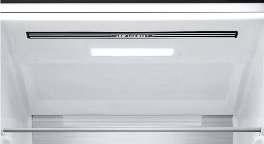 Wnętrze lodówki z widocznym napisem \'Door Cooling+\'.