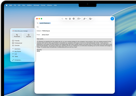 Na ekranie laptopa wyświetlony jest program pocztowy z otwartym e-mailem o temacie \'Following up\'. W tle widoczna jest niebieska tapeta.