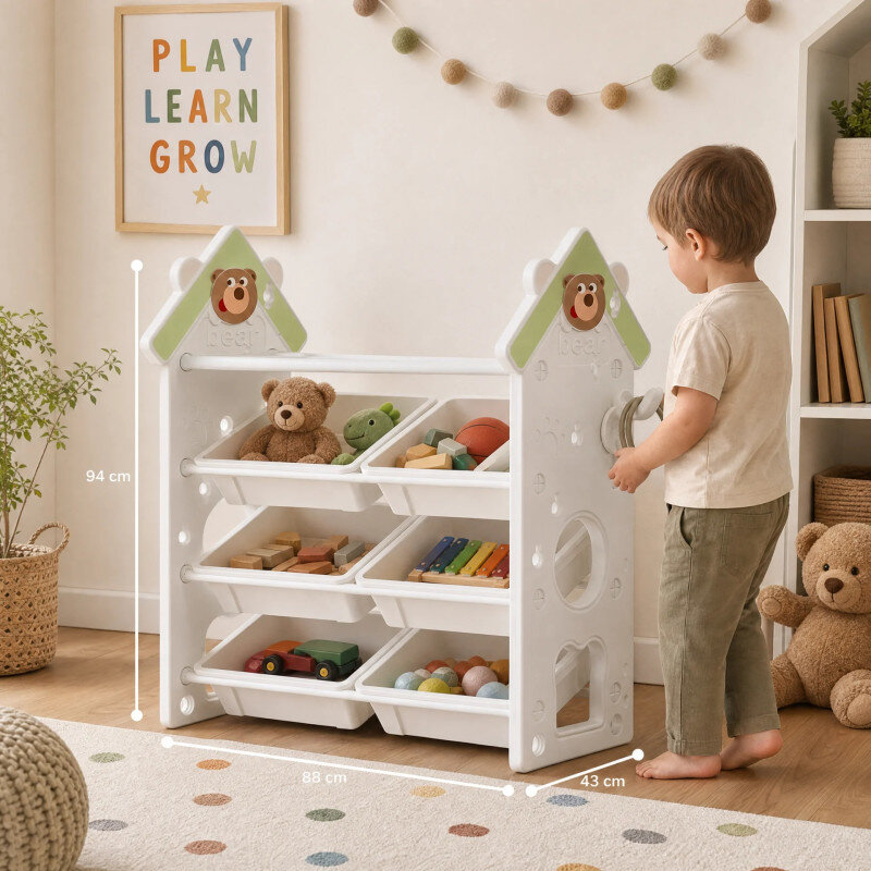 Na obrazie znajduje się biały regał z trzema poziomami pojemników, wypełnionych zabawkami i książkami. Na ścianie wisi plakat z napisem \'PLAY LEARN GROW\'.