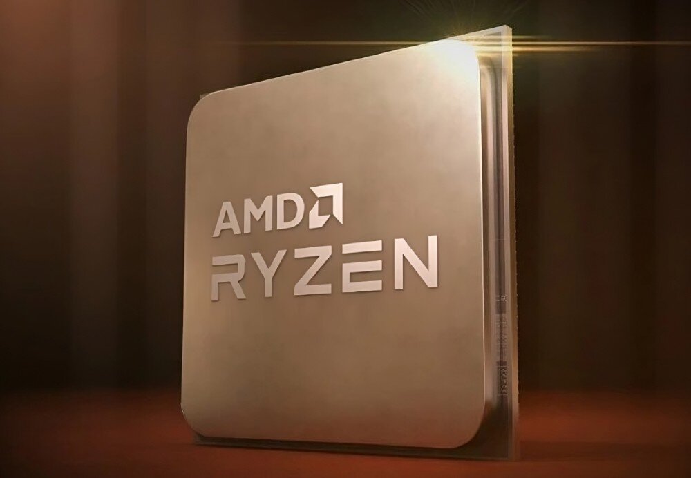 Obraz przedstawia metalową płytkę z wygrawerowanym napisem \'AMD RYZEN\'. Płytka jest oświetlona z boku, co tworzy efekt świetlny.