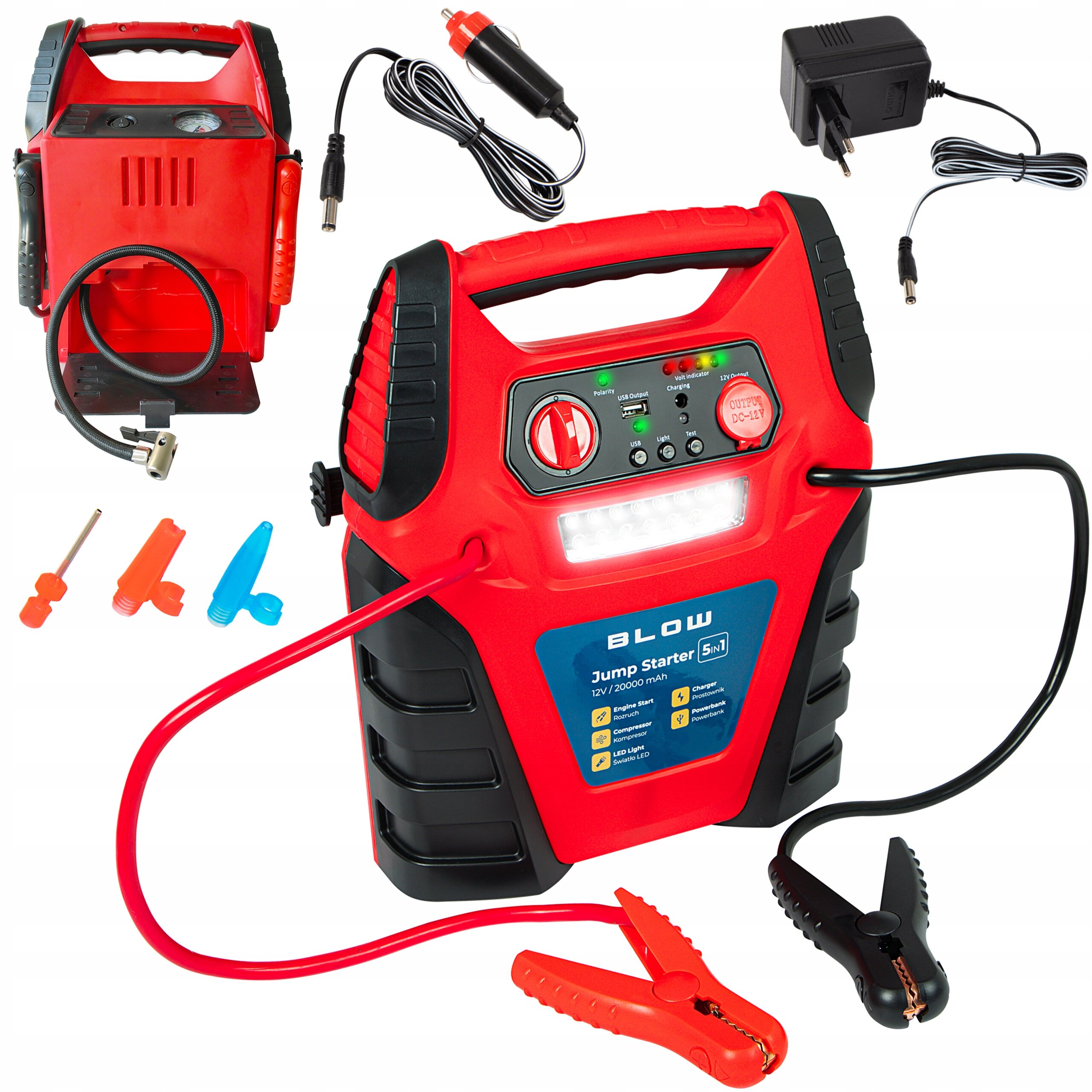 Na obrazie widoczny jest czerwono-czarny urządzenie z napisem \'BLOW Jump Starter 5in1 12V / 20000 mAh\', wyposażone w kable z zaciskami oraz różne akcesoria. W tle znajdują się dodatkowe elementy, takie jak ładowarka i adaptery.