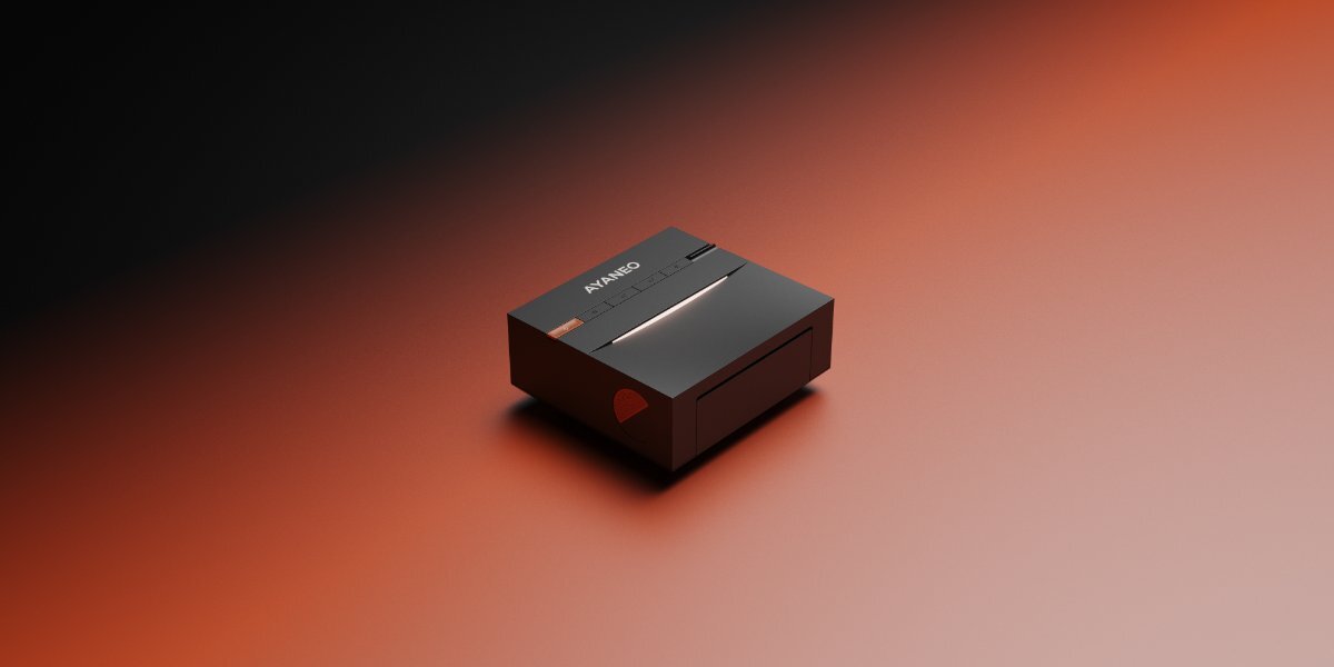 Czarny, prostokątny mini PC z widocznym logo \'AYANEO\' na górnej powierzchni, umieszczony na gradientowym tle przechodzącym od czerni do pomarańczu.