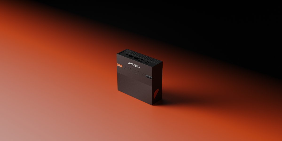 Czarny mini PC z napisem \'AYANEO\' na górnej części obudowy, umieszczony na tle przechodzącym z pomarańczowego do czarnego.