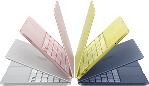 Sześć laptopów w różnych kolorach (srebrny, różowy, żółty, niebieski) ustawionych w formie wachlarza, z widocznymi klawiaturami i ekranami. Na obudowach znajduje się logo w kształcie nadgryzionego jabłka.