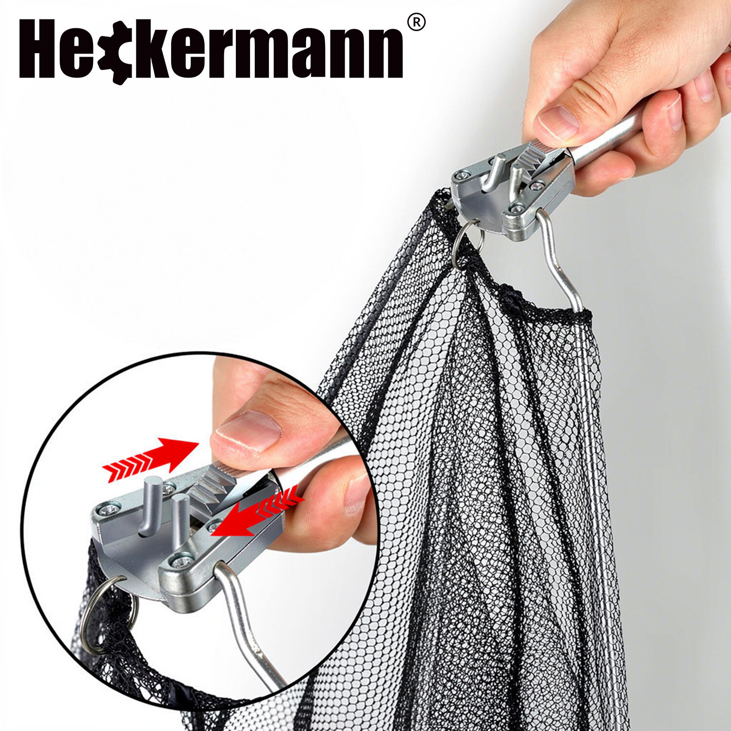 Osoba trzyma podbierak teleskopowy z metalowym uchwytem i siatką, z logo \'Heckermann\' widocznym na górze. W okrągłym powiększeniu pokazano mechanizm blokujący z czerwonymi strzałkami wskazującymi kierunek przesuwania.