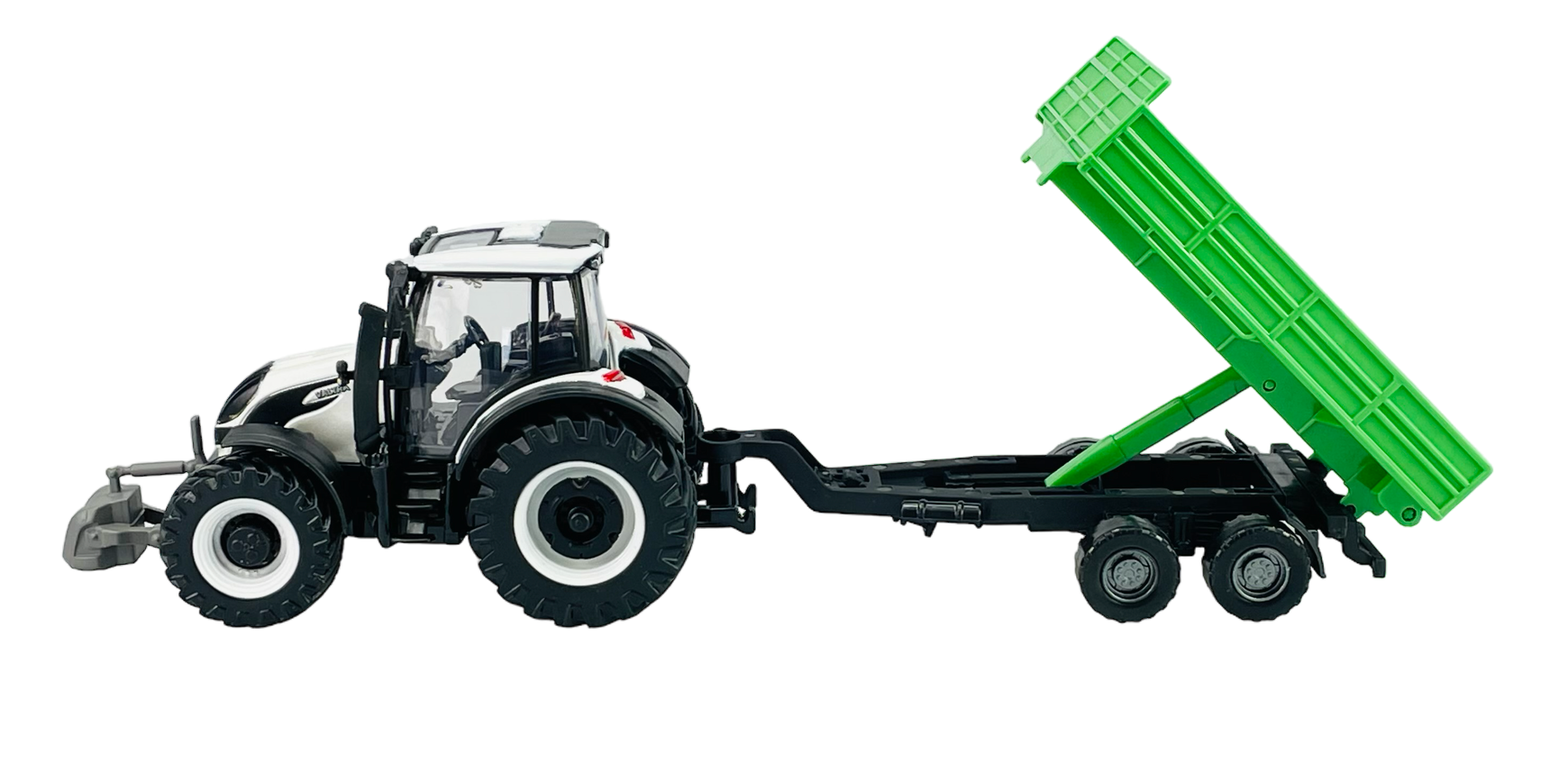 Model traktora z przyczepą, w kolorze czarnym z białymi elementami, oraz zieloną przyczepą uniesioną do góry. Traktor ma duże koła i szczegółową kabinę.