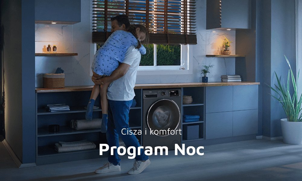W pomieszczeniu znajduje się suszarka w zabudowie, a na pierwszym planie osoba trzyma dziecko. Na obrazie widoczny jest tekst: \'Cisza i komfort Program Noc\'.