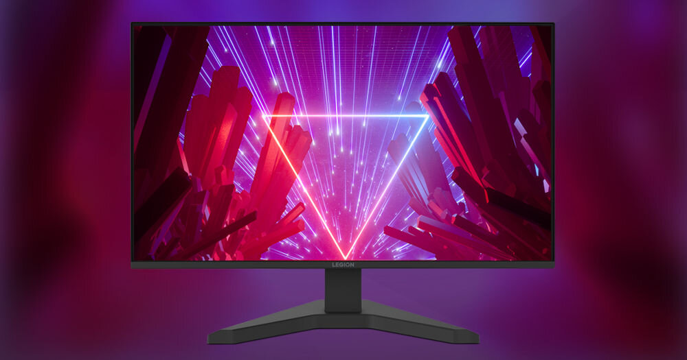 Monitor wyświetla grafikę z neonowym trójkątem i czerwonymi kryształami na fioletowym tle. Na dolnej ramce widoczne jest logo \'Legion\'.