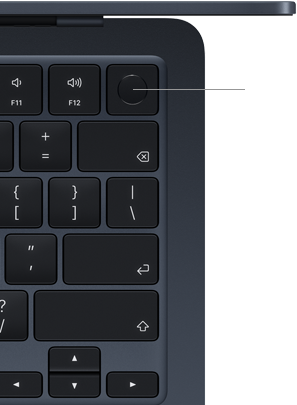 Fragment klawiatury laptopa z widocznymi klawiszami funkcyjnymi F11 i F12 oraz przyciskiem zasilania. Klawisze są w kolorze ciemnym z białymi symbolami.