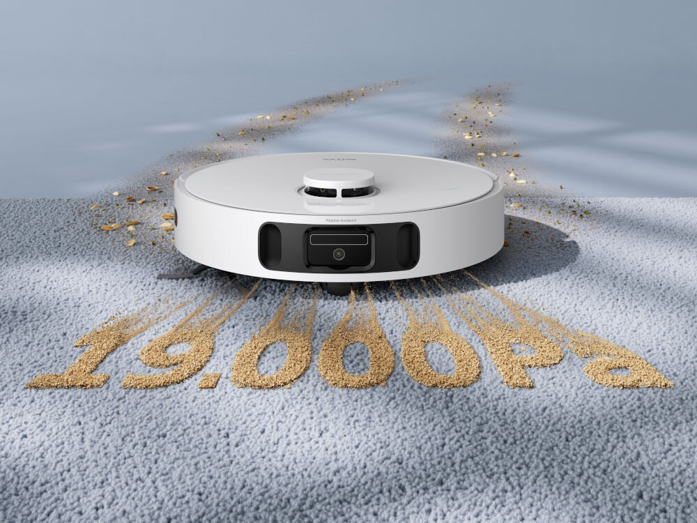 Na obrazie widoczny jest biały robot sprzątający na dywanie, z napisem \'19,000 pa\' ułożonym z drobnych ziarenek. Na robocie znajduje się logo \'MOVA\'.