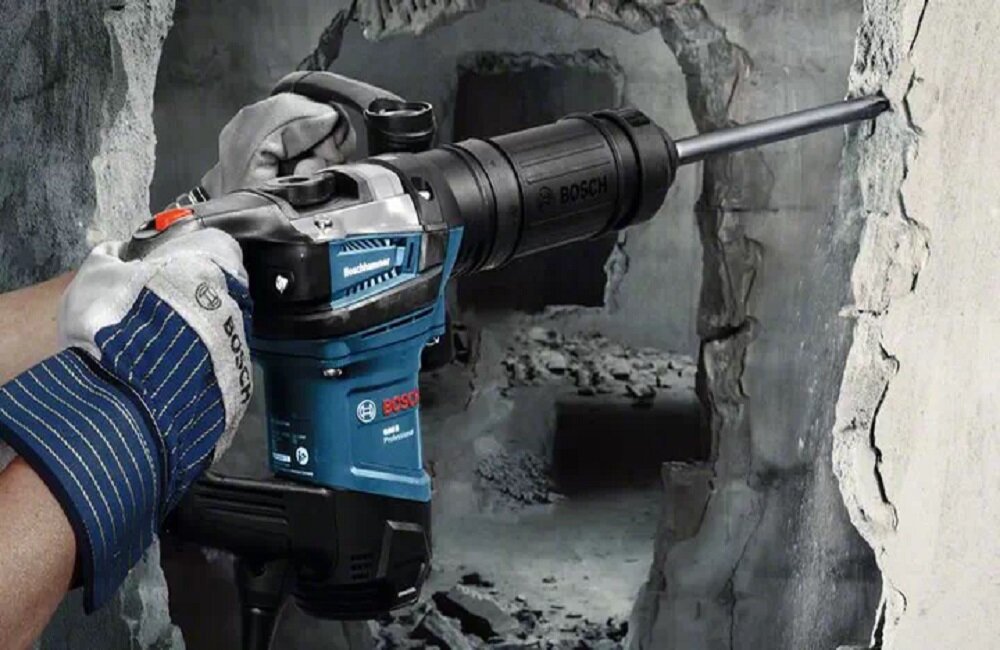 Młot udarowy BOSCH GSH 5 Professional Najdłuższa żywotność w tej klasie narzędzi oraz imponująca moc Zamknięta rękojeść dodatkowa