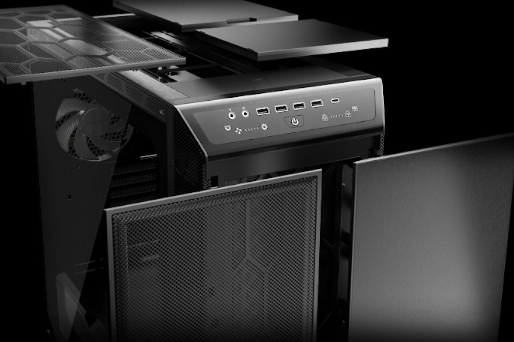 Obraz przedstawia obudowę komputera z otwartymi panelami bocznymi i górnym. Na przednim panelu widoczne są porty USB, przycisk zasilania oraz logo \'BE QUIET!\'.