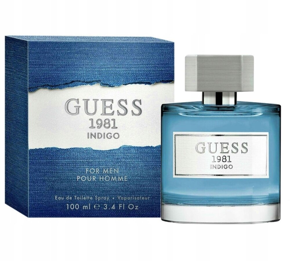 Na obrazie widoczny jest flakon perfum oraz pudełko z napisem \'GUESS 1981 INDIGO\'. Pudełko ma niebieski wzór przypominający dżins, a flakon jest przezroczysty z niebieskim płynem w środku.