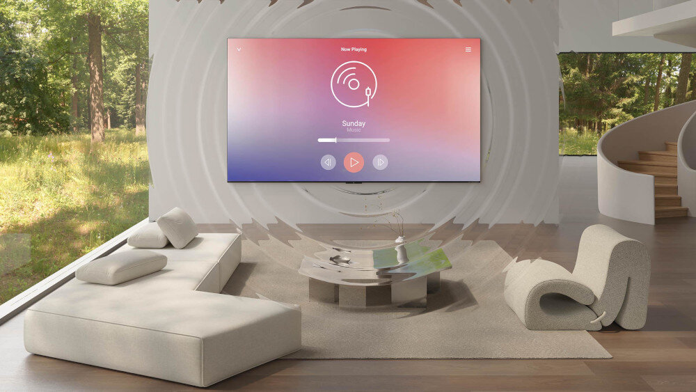Telewizor TCL 85C8K - Dźwięk od ekspertów, Bang & Olufsen, telewizor powieszony na ścianie w salonie