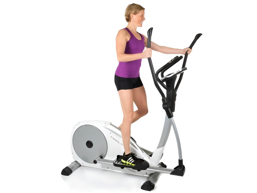 Orbitrek elektromagnetyczny FINNLO Loxon XTR 20kg 42cm osoba ćwiczy na sprzęcie mocne opory hamowania waga koła zamachowego wynosząca 20 kg stabilność i płynność ruchu antypoślizgowe stopki regulowana stopka maksymalna waga użytkowania do 150 kg