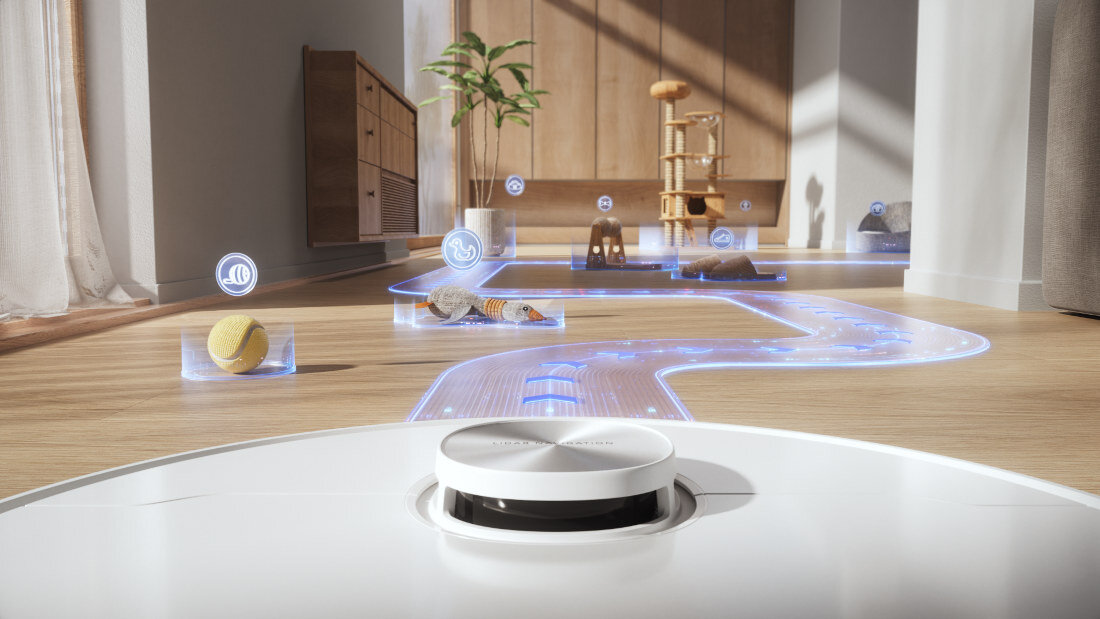 Robot sprzątający porusza się po drewnianej podłodze, omijając przeszkody takie jak piłka i zabawki. Na podłodze widoczna jest niebieska, świetlna ścieżka wskazująca trasę robota.