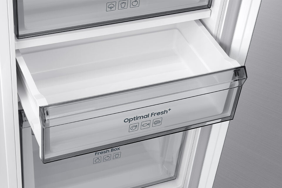 Zdjęcie przedstawia otwartą szufladę lodówki z napisem \'Optimal Fresh+\'. Poniżej znajduje się kolejna szuflada z napisem \'Fresh Box\'.