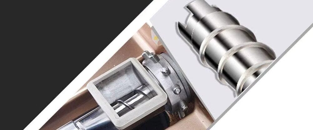 Obraz przedstawia metalowy element mechanizmu, prawdopodobnie część wyciskarki, z widocznymi śrubami i spiralnym wałkiem. Tło jest w odcieniach czerni i szarości.