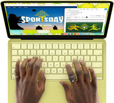 Osoba pisze na klawiaturze laptopa w kolorze jasnozielonym. Na ekranie widoczne są dwie aplikacje: przeglądarka z napisem \'Sports Day\' oraz aplikacja pocztowa.