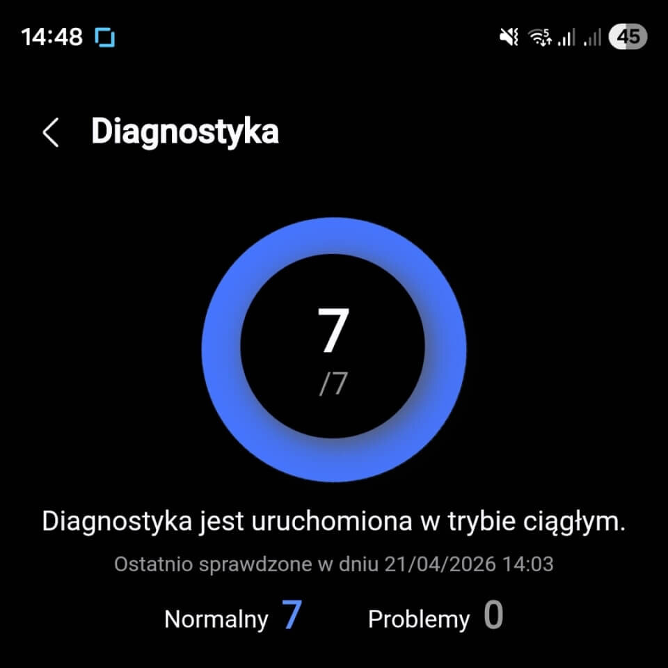 Informacje o błędach Ekran diagnostyki z niebieskim okręgiem i liczbą 7/7 w środku. Tekst: \'Diagnostyka jest uruchomiona w trybie ciągłym. Ostatnio sprawdzone w dniu 21/04/2026 14:03\', \'Normalny 7\', \'Problemy 0\'.