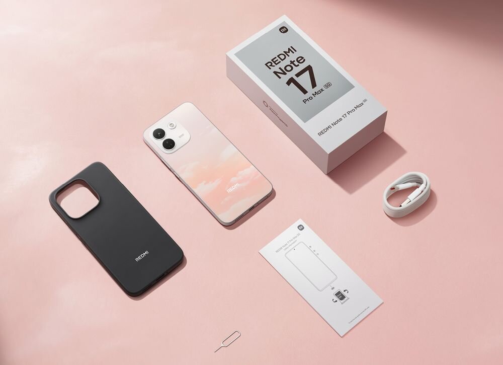 Na różowym tle znajduje się smartfon z gradientowym tyłem, obok czarne etui, pudełko z napisem \'REDMI Note 17 Pro Max\', kabel USB oraz instrukcja obsługi. Widoczny jest również kluczyk do tacki SIM.