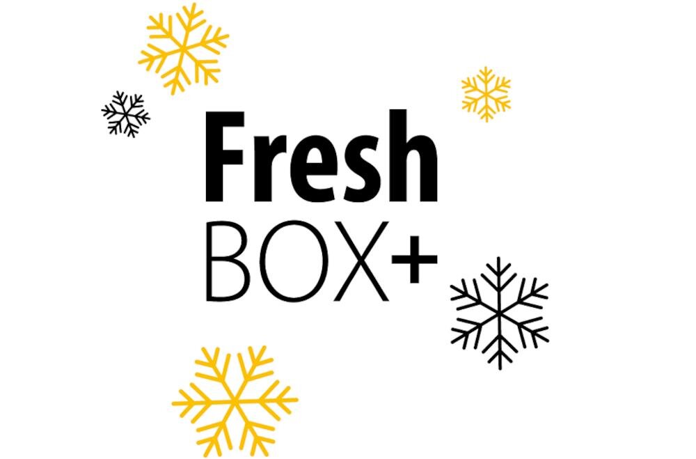 Grafika przedstawia napis \'Fresh BOX+\' otoczony żółtymi i czarnymi płatkami śniegu.