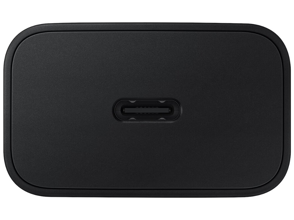Czarna ładowarka sieciowa z portem USB-C na środku. Powierzchnia jest gładka i matowa.