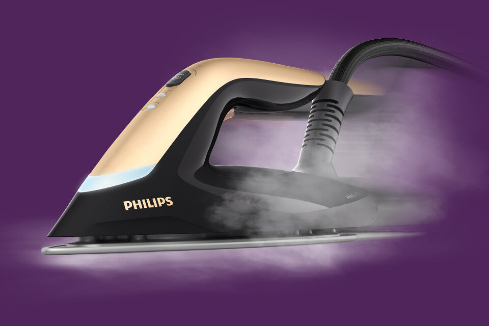 Na fioletowym tle widoczny jest generator pary z napisem PHILIPS, z którego wydobywa się para.