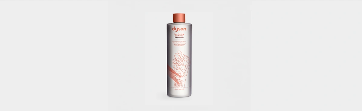 Płyn do płukania jamy ustnej Dyson Ginger Mint w butelce z pomarańczową nakrętką