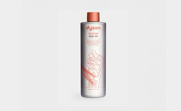 Płyn do płukania jamy ustnej Dyson Ginger Mint w butelce z pomarańczową nakrętką