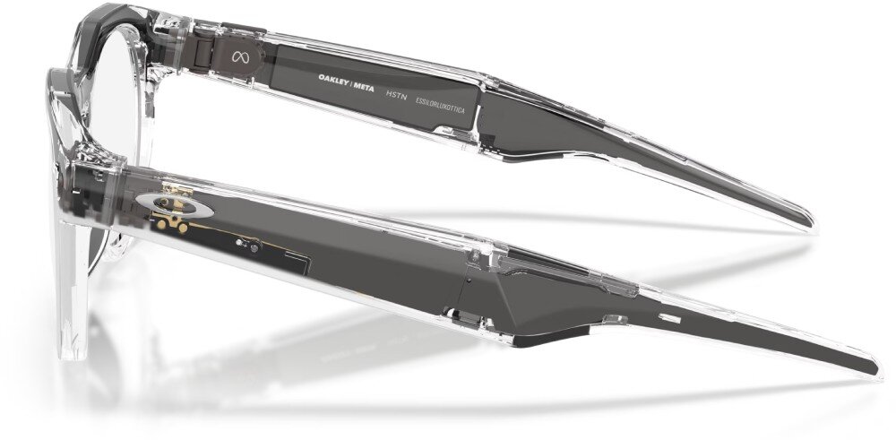 Przezroczyste okulary z ciemnymi zausznikami, na których widnieje napis \'OAKLEY META HSTN\'.